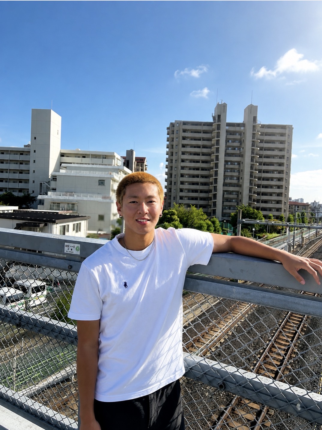 Toa, your Tokyo local guide, on a footbridge over the train tracks